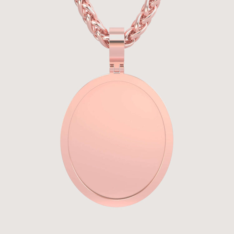 A close-up of the 14K Gold Classic Oval Picture Pendant in rose gold shows its polished, smooth finish on a matching twisted chain, set against a plain light background.