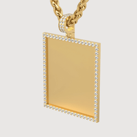 The 14k Gold Customizable Picture Pendant with Diamonds features a rectangular 14K gold pendant bordered with small diamonds, a diamond-encrusted bail, and hangs from a thick twisted gold chain—perfect for adding your own photo.