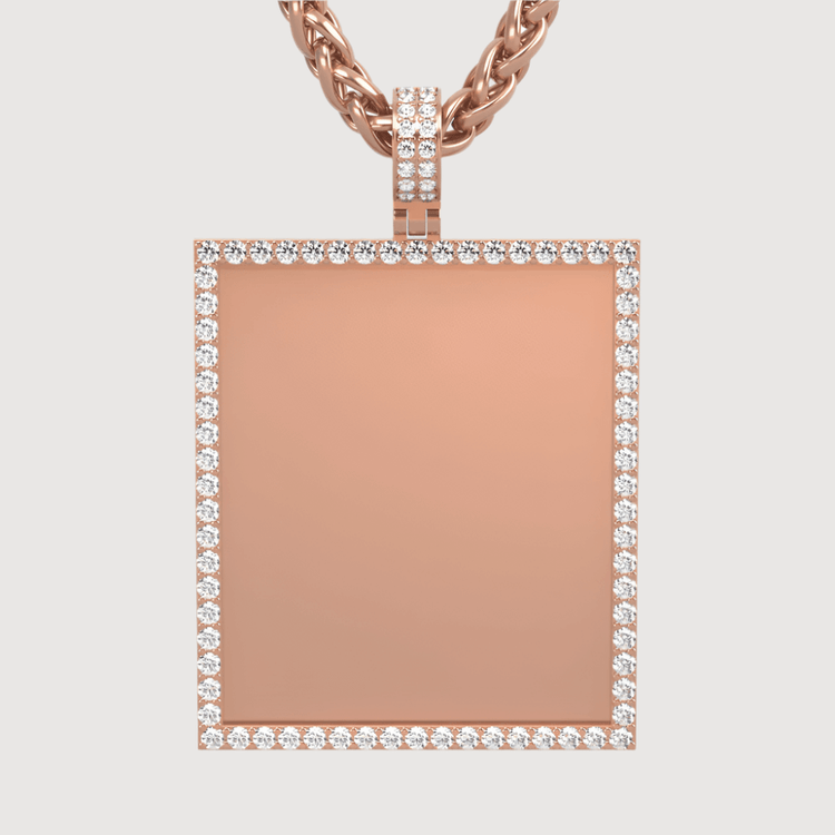 The 14k Gold Customizable Picture Pendant with Diamonds features a rectangular rose gold design bordered by sparkling diamonds, hanging from a twisted rose gold chain against a plain background.