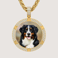The 14K Gold Diamond-Accented Round Picture Pendant displays a Bernese Mountain Dog with a black, white, and brown coat sitting and facing forward, tongue out, in a sparkling circular gold setting.