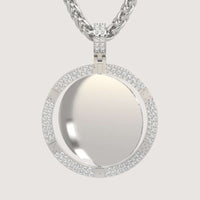 The 14K Gold Diamond-Accented Round Picture Pendant features a smooth, reflective center bordered by sparkling diamonds and hangs from a twisted gold chain against a light background.