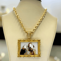 A 14K Gold Diamond Bail Big Frame Picture Pendant featuring a rectangular design with an ornate frame and blurred group photo, displayed on a gold rope chain necklace atop a beige jewelry bust.