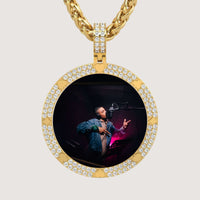 A 14K Gold Diamond Card Suit Round Picture Pendant featuring a photo of a person in a recording studio, wearing headphones and singing into a microphone.