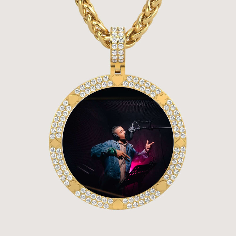 A 14K Gold Diamond Card Suit Round Picture Pendant featuring a photo of a person in a recording studio, wearing headphones and singing into a microphone.