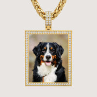 The 14K Gold Diamond Frame Rotating Photo Pendant features a happy Bernese Mountain Dog and hangs from a thick gold chain.