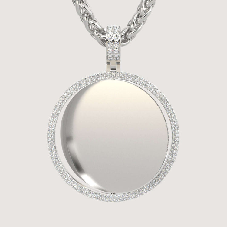 The 14K Gold Double Diamond Halo Round Picture Pendant features a reflective round center, outlined by two rows of sparkling diamonds, and hangs from a thick, twisted gold chain against a plain light background.