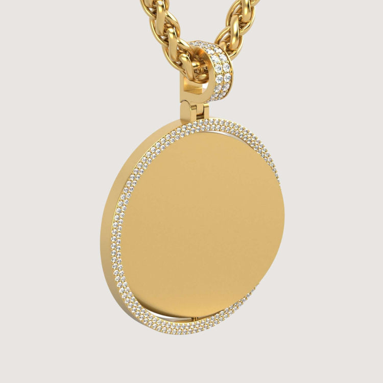 The 14K Gold Double Diamond Halo Round Picture Pendant features a sparkling diamond halo and hangs from a thick gold chain with a diamond-studded loop, displayed against a plain light background.