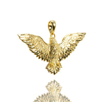 The 14k Yellow Gold Eagle Pendant features outstretched wings, detailed feathers, and a top loop for a chain, displayed on a white background with a subtle reflection.