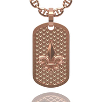 The 14k Gold Fleur De Lis Dog Tag Pendant features a textured pattern with a raised fleur-de-lis at the center and hangs from a round-link chain.