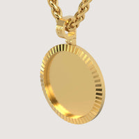 A close-up of the 14K Gold Fluted Round Picture Pendant, featuring a ridged edge and suspended from a thick gold chain against a plain light background.