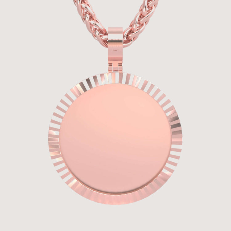 The 14K Gold Fluted Round Picture Pendant in rose gold hangs from a twisted chain against a light background—an elegant choice for cherished photo keepsake necklaces.