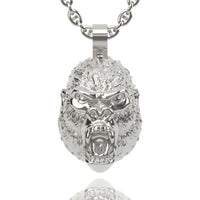 The 14k Gold Gorilla Head Pendant showcases a detailed roaring gorilla’s head with bared teeth and expressive features—a bold gold statement piece.