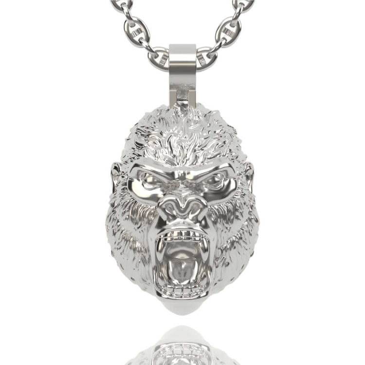 The 14k Gold Gorilla Head Pendant showcases a detailed roaring gorilla’s head with bared teeth and expressive features—a bold gold statement piece.
