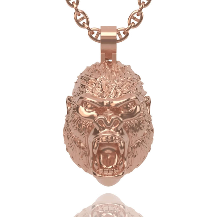 Introducing the 14k Gold Gorilla Head Pendant—crafted in solid gold, this pendant features a roaring gorilla’s head with detailed facial features and textured fur, making it an impressive statement piece suspended from a matching chain.