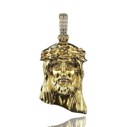 The 14K Gold Jesus Face Pendant with Diamond Bail features a detailed Jesus Christ face design with a crown of thorns and a bail set with sparkling diamonds.