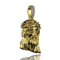 The 14K Gold Jesus Face Pendant with Diamond Bail features a long-haired face and crown of thorns, sparkling with diamonds on the bail, shown against a white background.