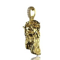 The 14K Gold Jesus Face Pendant with Diamond Bail features a detailed Jesus face with a crown of thorns and long hair, perfect for attaching to a chain and shown on a white background.