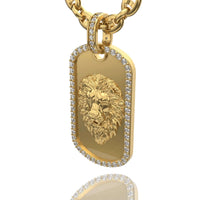 The 14K Gold Diamond Lion Dog Tag Pendant features a detailed lion's head in relief, bordered with diamonds, and hangs from a gold chain—an eye-catching piece of lion jewelry for bold style.