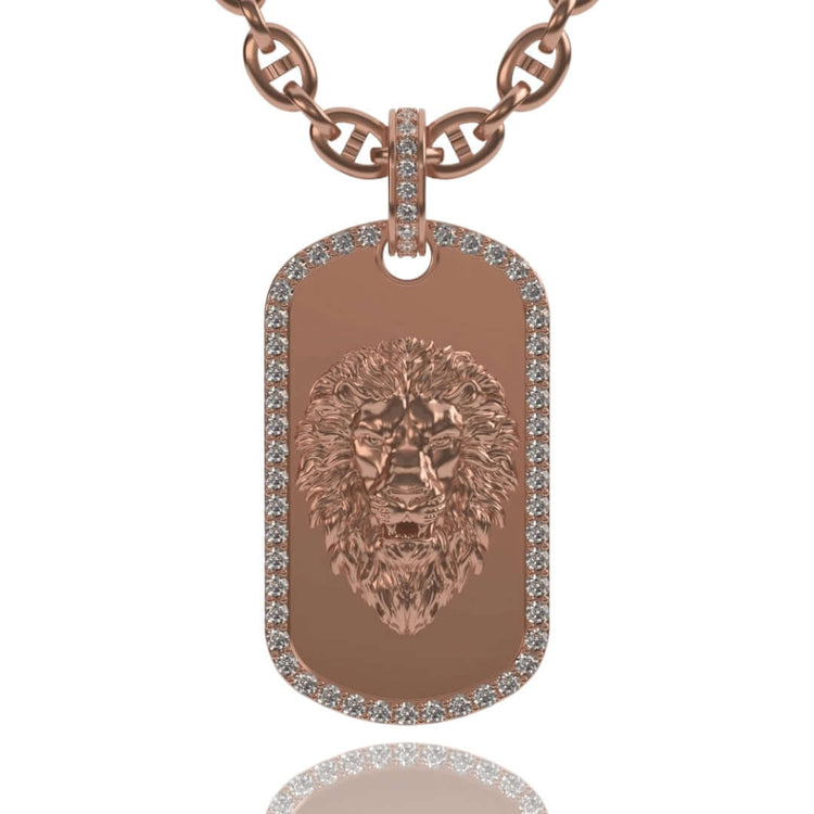 The 14K Gold Diamond Lion Dog Tag Pendant showcases a detailed lion head engraving, bordered with sparkling diamonds, and hangs on a matching rose gold chain.