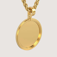 The 14K Gold Modern Double Border Round Picture Pendant features a shiny, smooth round design and hangs from a thick, twisted gold chain against a plain light background.