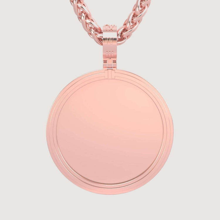The 14K Gold Modern Double Border Round Picture Pendant, crafted in polished 14K rose gold, showcases a smooth, elegant design and hangs from a twisted chain, offering timeless style with no engraving or extra decoration.