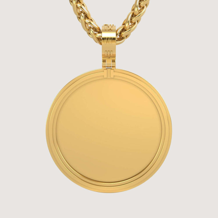 The 14K Gold Modern Double Border Round Picture Pendant hangs from a thick, twisted gold chain, its smooth surface gleaming against a light background.