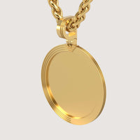 The 14K Gold Modern Grooved Round Picture Pendant features a smooth, blank circular face and hangs from a thick gold chain against a plain light background.