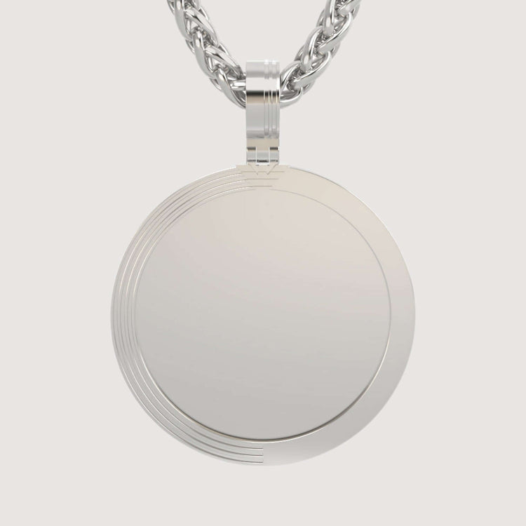A close-up of the 14K Gold Modern Grooved Round Picture Pendant, featuring subtle engraved lines on the edge and hanging from a thick twisted chain against a plain light background.