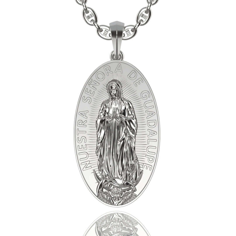 A 14k gold oval pendant on a chain features the image of Our Lady of Guadalupe, with the Spanish inscription NUESTRA SEÑORA DE GUADALUPE—an elegant Nuestra Virgen de Guadalupe Pendant to cherish.