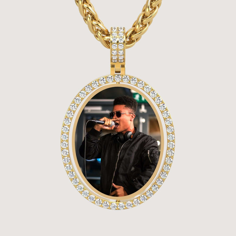The 14K Gold Open Oval Diamond Picture Pendant is a photo necklace featuring an image of a person in sunglasses and headphones singing into a microphone.