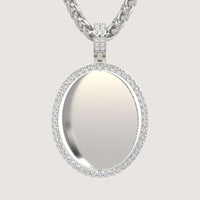 The 14K Gold Open Oval Diamond Picture Pendant features small diamonds and a smooth, reflective center, hanging from a thick braided silver chain against a plain light background for timeless elegance.