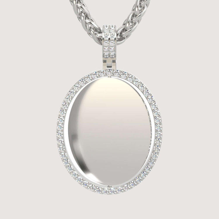 The 14K Gold Open Oval Diamond Picture Pendant features small diamonds and a smooth, reflective center, hanging from a thick braided silver chain against a plain light background for timeless elegance.