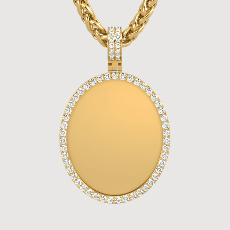 The 14k Gold Oval Picture Pendant with Diamonds features a gold oval framed by white diamonds on a twisted gold chain, shown against a plain light background.