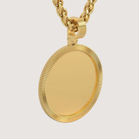 A close-up of the 14K Gold Ribbed Round Picture Pendant, highly polished and blank, hangs from a thick gold chain against a plain background—perfect for personalized gold jewelry.