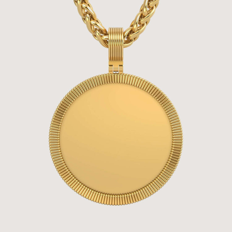 The 14K Gold Ribbed Round Picture Pendant features a textured edge and hangs from a thick, twisted gold chain. Its smooth, unadorned center is ideal for personalizing your gold jewelry style against any simple backdrop.