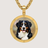 The 14K Gold Round Engraved Border Picture Pendant features a circular frame displaying a Bernese Mountain Dog, shown looking forward with its tongue out and a black, white, and brown coat.