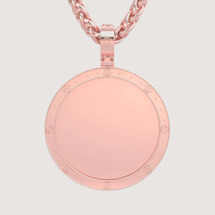 The 14K Gold Round Engraved Border Picture Pendant features a polished center, a decorative engraved border, and hangs from a classic rope-style chain—combining timeless elegance with refined detail.