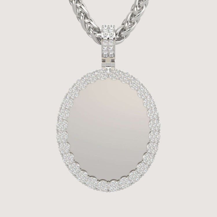 The 14K Gold Scalloped Oval Diamond Photo Pendant features a reflective center bordered by sparkling diamonds, all elegantly hanging from a twisted chain for a timeless, sophisticated look.