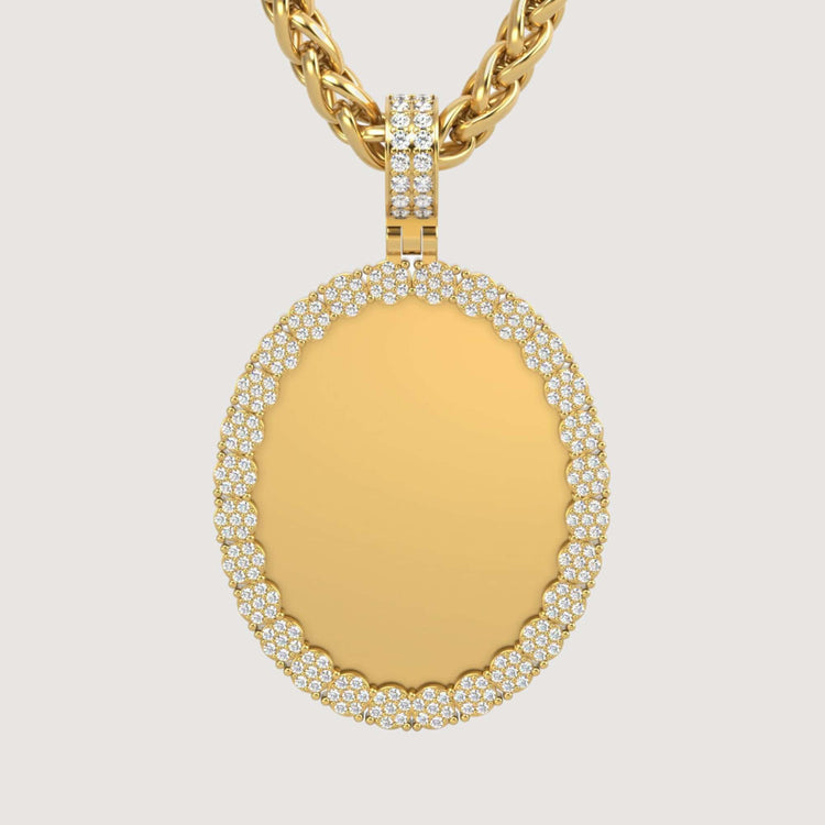 The 14K Gold Scalloped Oval Diamond Photo Pendant features a smooth oval center framed by two rows of sparkling diamonds, hanging from a textured gold chain against a plain light background.