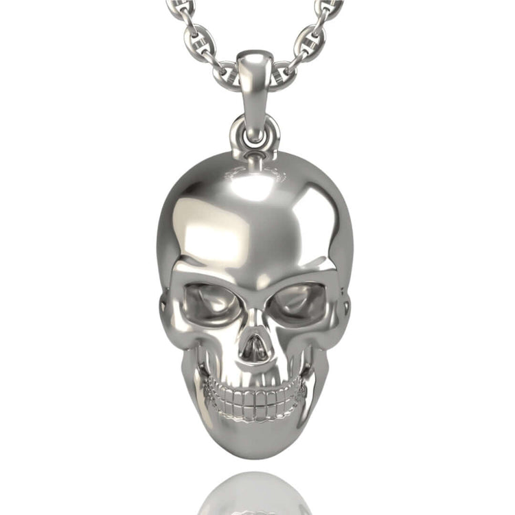 A 14k Gold Skull Pendant with detailed facial features—including eye sockets, nose, and teeth—hangs vertically on a chain against a plain white background, its polished surface reflecting light.