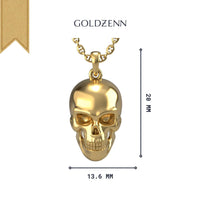 The 14k Gold Skull Pendant necklace features a bold 20mm x 13.6mm pendant on a chain, shown on a white background with the GOLDZENN brand name at the top.