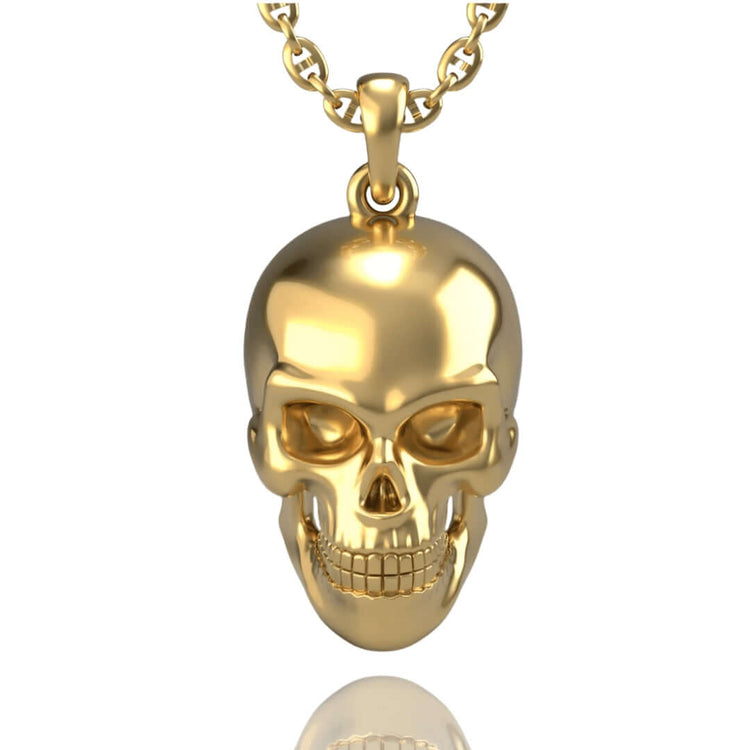 The 14k Gold Skull Pendant showcases smooth, polished details and intricate facial features, elegantly hanging from a matching gold chain.