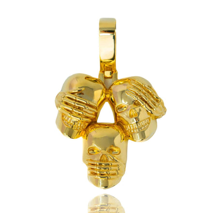 The Hear No Evil, See No Evil, Speak No Evil Gold Pendant features three polished 14K gold skulls inspired by Japanese philosophy, symbolizing see no evil, hear no evil, and speak no evil.