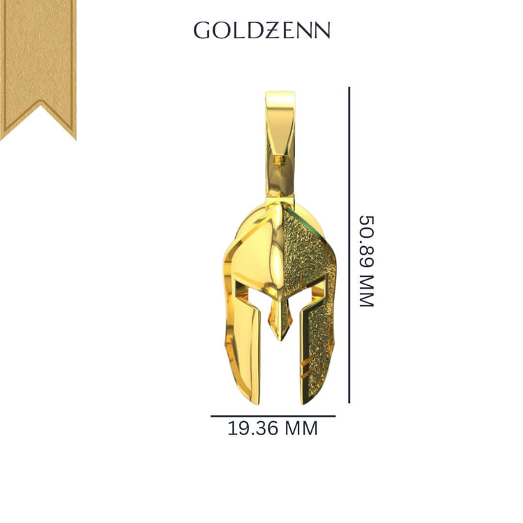 The 14k Gold Heroic Spartan Helmet Pendant showcases a helmet-shaped gold design with a top loop, measuring 50.89 mm tall by 19.36 mm wide. The word GOLDZENN is displayed above this striking pendant on a white background.