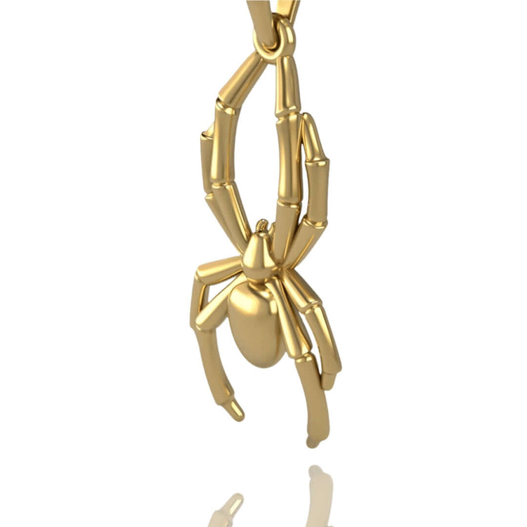 The 14k Gold Spider Pendant features detailed legs and a polished body, creating an elegant spider jewelry piece that hangs from a loop against a white background.