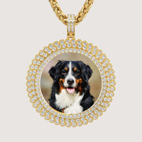 The 14K Gold Sunburst Diamond Round Picture Pendant features a circular frame with a sunburst design and showcases a photo of a Bernese Mountain Dog at its center.