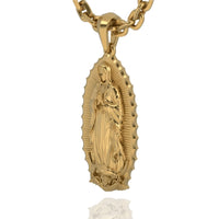 The 14k Gold Virgen de Guadalupe Pendant features an embossed Virgin Mary with a radiant scalloped edge, suspended from a thick chain—a timeless piece of faith jewelry.