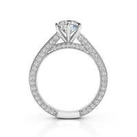 The 14k Round Lab Diamond Engagement Ring - Prong Setting features a round solitaire lab diamond with pavé-set diamonds along the band and profile, adding extra sparkle—an elegant women’s engagement ring.