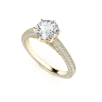 The 14k Round Lab Diamond Engagement Ring features a large round lab diamond in a prong setting, with smaller diamonds on a split shank band, beautifully displayed against a white background.
