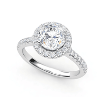The 14k Round Lab Diamond Halo Setting Engagement Ring features a brilliant round center diamond in a halo setting, accented by smaller diamonds along the band—an elegant choice for those seeking sophisticated gold engagement rings.